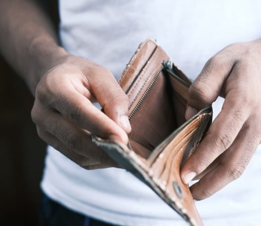 How to Get Money for Bail Bond man hand open an empty wallet